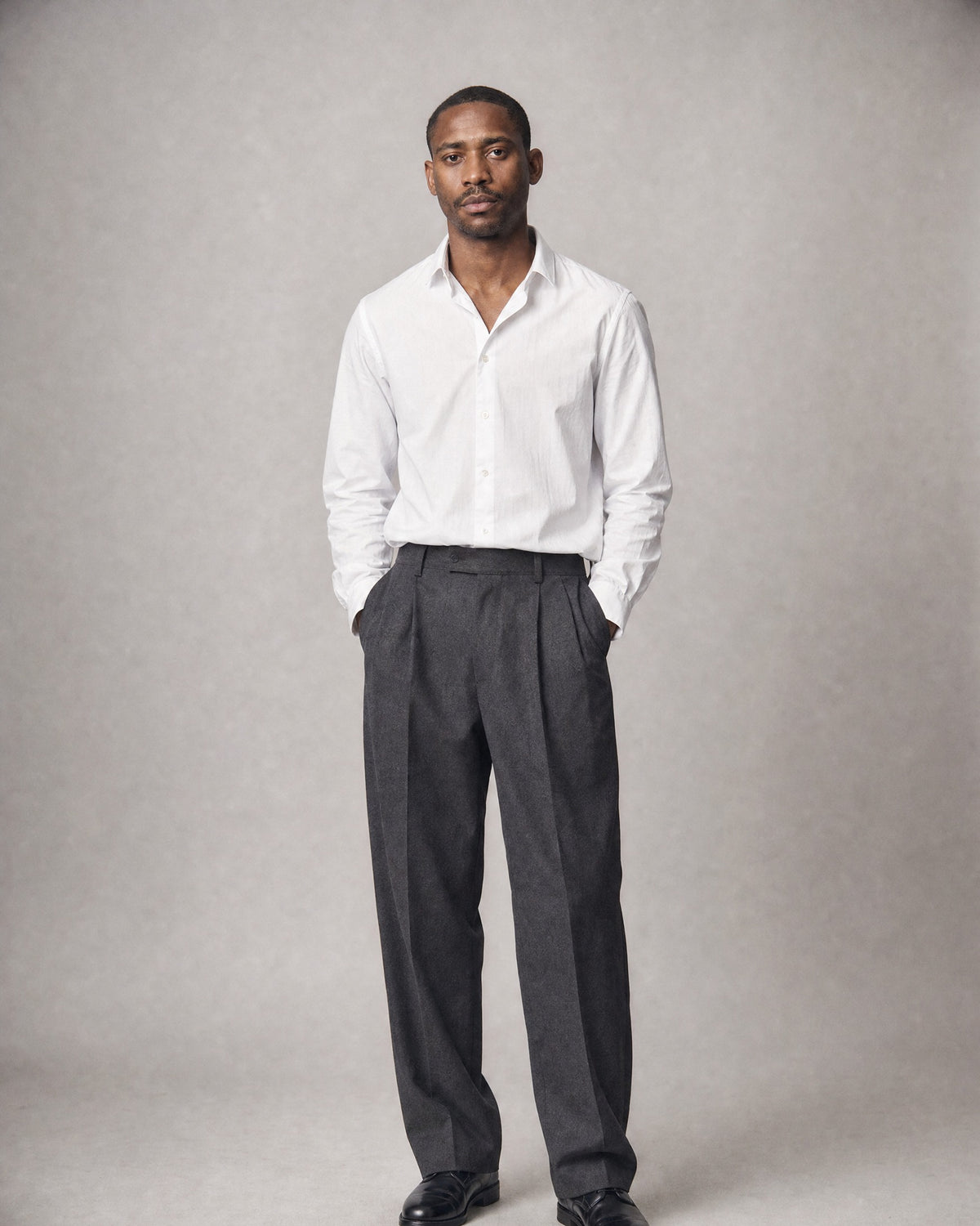 Men's Herringbone Pleated Trousers worn, front | Belmorne